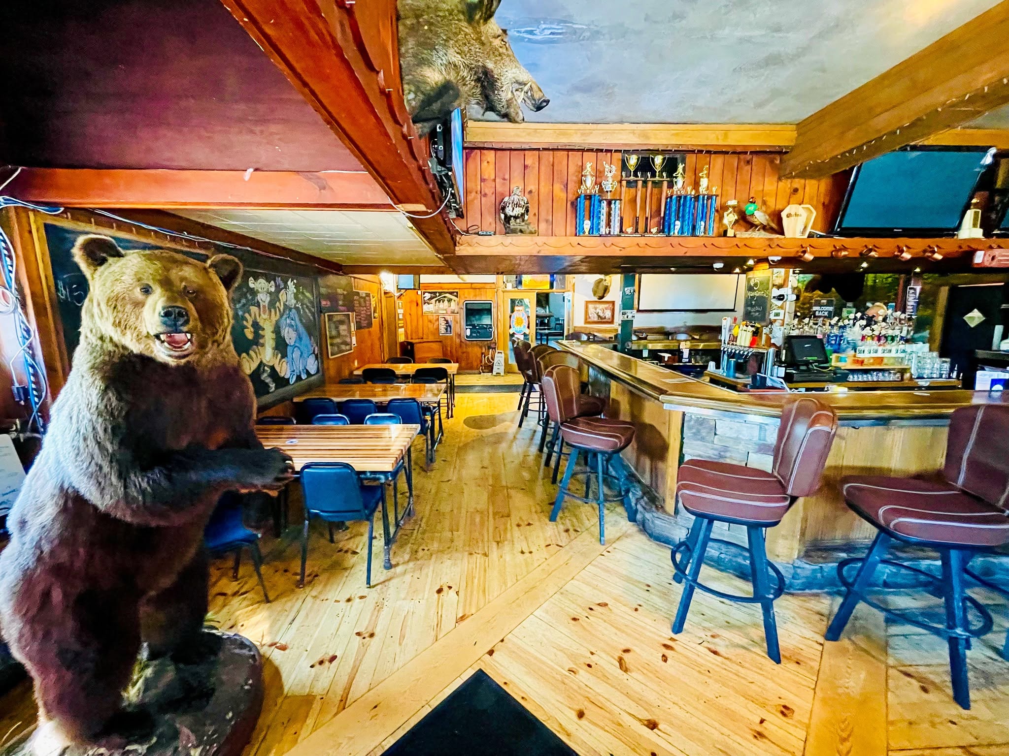 A Bar filled with taxidermy and tables