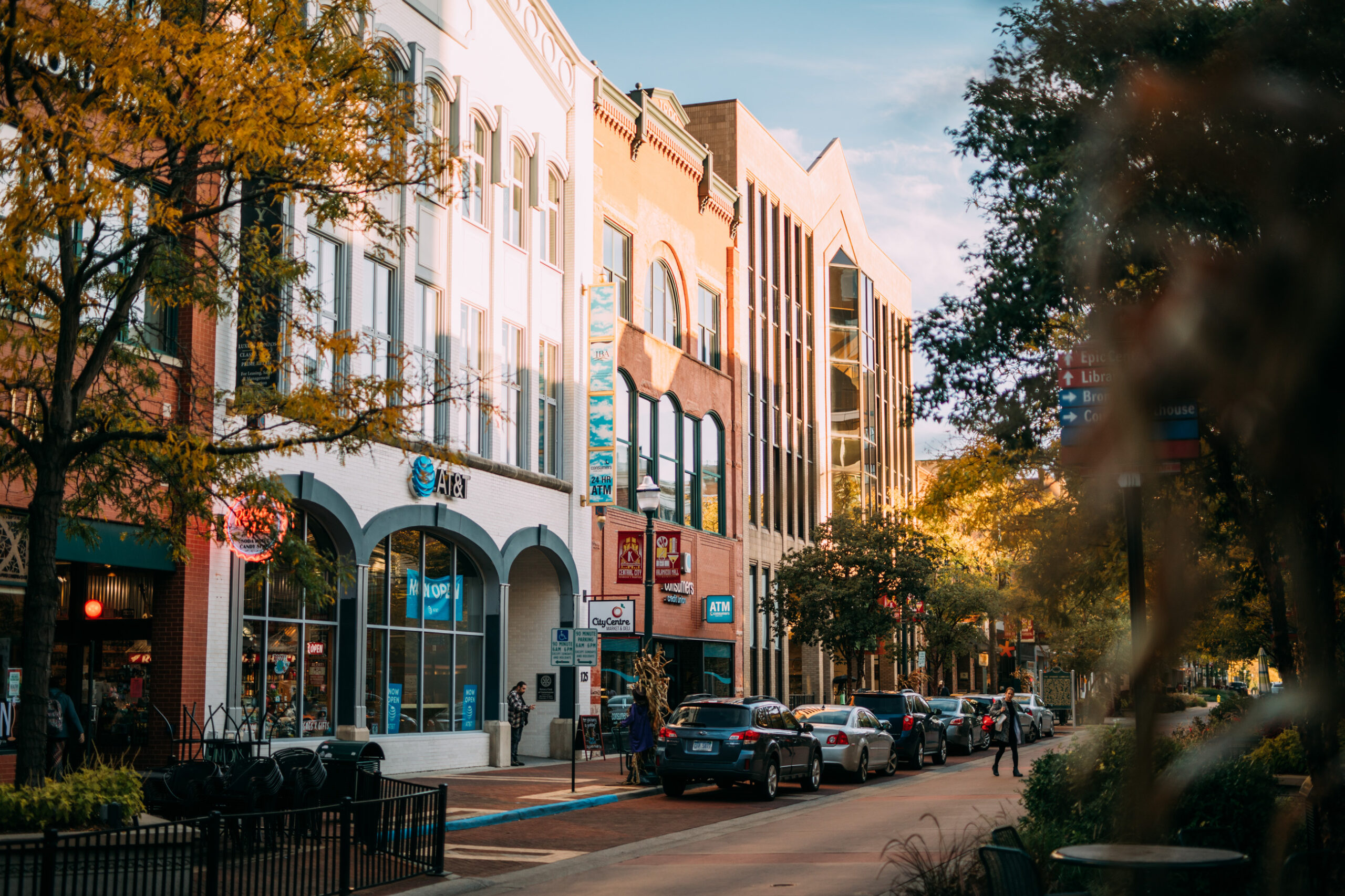 View of a downtown street with shops at dusk